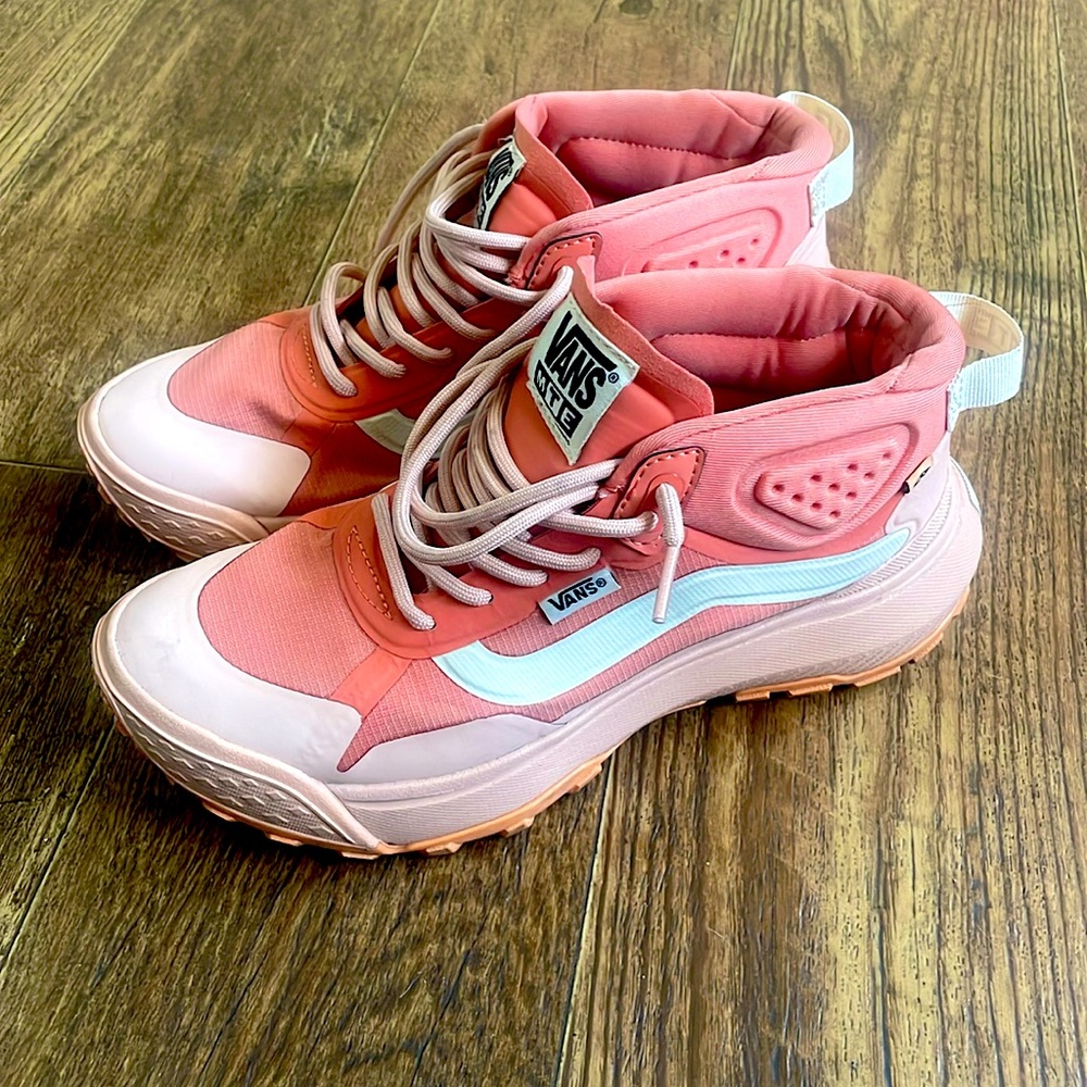 Coral pink vans.